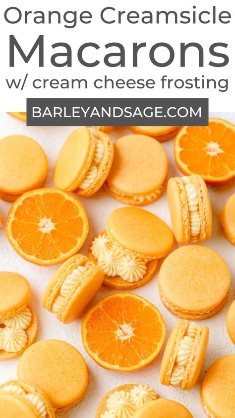 These orange creamsicle macarons have a light, orange flavored macaron shell filled with a vanilla cream cheese frosting. They taste just like a classic orange creamsicle but in macaron form! Orange And Blue Macarons, Orange Macarons Aesthetic, Spring Macarons Flavors, Orange Cream Dessert, Orange Macarons Recipe, Fruity Macaron Flavors, Macarons Fillings Recipe, Banana Cream Pie Macaron, Orange Creamsicle Macaron