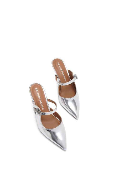 This KG Kurt Geiger Alina Mule heel features a metallic silver upper. There is a strap across the foot which is accented with a silver buckle and branding detail. Heel height: 7.5cm. 100% Synthetic rubber. Faux Leather Heels, Kurt Geiger, Mid Heel, Leather Heels, Heeled Mules, Metallic Silver, Heel Height, Faux Leather, Buckle