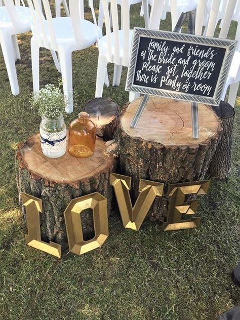 Rustic tree stump aisle decor. Used the LOVE letters and sign at the entrance to the aisle. Sign reads "Family and friends of the bride and the groom, please sit together there is plenty of room". Tree Stump Wedding Decor, Gala Decorations, Wood Stumps, Wedding Isles, Tree Stumps, Wedding Country, Rustic Glam, Aisle Decor, Tree Stump