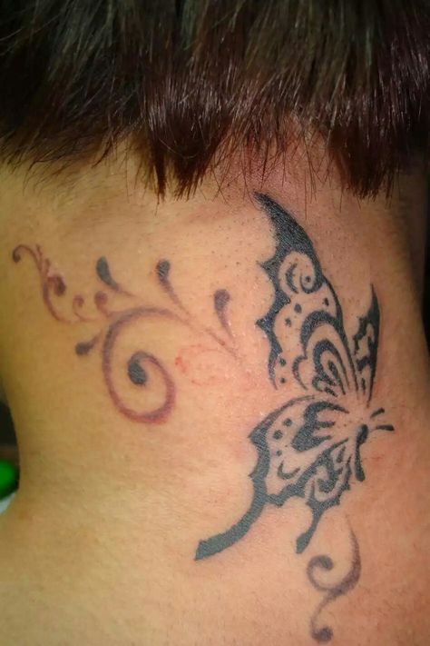 Butterfly on back of neck Butterfly On Back Of Neck, 2000s Butterfly, Tattoos On Back, Mens Butterfly Tattoo, Butterfly Tattoo Cover Up, Butterfly Tattoos Images, Butterfly Name Tattoo, Butterfly Tattoo On Shoulder, Butterfly Back Tattoo