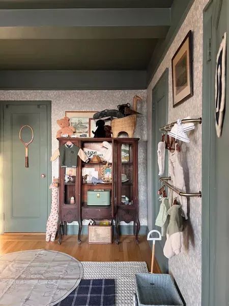 Nursery decor (cabinet is an antique find) #LTKkids #LTKbaby #LTKhome Pretty In The Pines Nursery, China Cabinet In Nursery, Pretty In The Pines Shelby, Feeling Some Type Of Way, Antique Nursery, Pretty In The Pines, Checkered Area Rug, Traditional Nursery, Tamworth