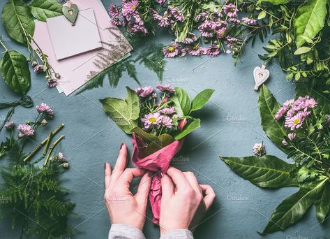 Hands making flowers bouquet by VICUSCHKA on @creativemarket Florist Workspace, Bouquet Of Pink Flowers, Wrapped Flowers, Florist Tools, Bouquet Arrangement, Female Hands, Making Flowers, Ivy House, Bouquet Arrangements