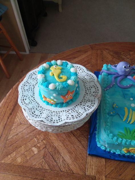 A "smash" cake with an under-the-sea theme Under The Sea Birthday Smash Cake, Sea Themed Smash Cake, Under The Sea Smash Cake 1st Birthdays, Sea Smash Cake, Under The Sea Smash Cake, Under The Sea Cake Smash, Photo Corner, 1 Year Birthday, Sea Cakes