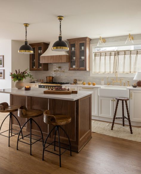 Tour This Turn of The Century Classic Colonial - The Interior Collective Walnut Island Kitchen, Dark Walnut Kitchen Cabinets, Dark Walnut Kitchen, Dark Wood Island, Kitchen Wood Flooring, Kitchen Island Colors, Kitchen Cabinets Brown, Modern Walnut Kitchen, Walnut Kitchen Island