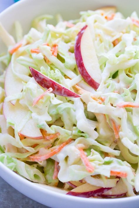 A creamy no mayo coleslaw made with Greek yogurt. This healthier coleslaw comes together in minutes and you'll love the addition of the sweet apple! | www.kristineskitchenblog.com Coleslaw Recipe Greek Yogurt, No Mayo Coleslaw, Apple Coleslaw, Healthy Coleslaw, Easy Coleslaw, Coleslaw Recipe Easy, Slaw Dressing, Coleslaw Dressing, Pork Sandwiches