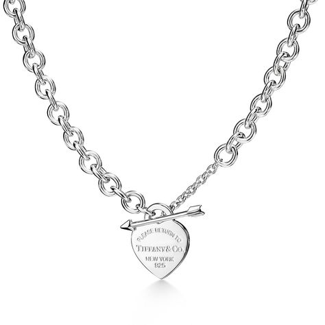 Inspired by a key ring we debuted in 1969, the Return to Tiffany® collection is famous for its signature motif. This sterling silver necklace features an arrow-shaped toggle closure that makes a perfect pair with the iconic heart tag. Wear as a statement piece or mix with pendants of different lengths for an unexpected look. Sterling silver; 16" long; Motif size, medium; Toggle closure | Return to Tiffany® Lovestruck Heart Tag Necklace in Silver, Medium Return To Tiffany Necklace, Drop Necklaces, Diamond Drop Necklace, Tiffany And Co Necklace, Return To Tiffany, Tiffany Necklace, Heart Pendants, International Jewelry, Heart Tag