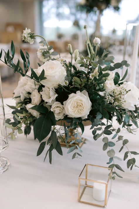 White Roses With Eucalyptus Centerpieces, Green And White Roses Wedding, Wedding Florals Greenery And White, White Roses And Eucalyptus Wedding, Greenery And Flowers Centerpiece, Wedding Reception Flower Centerpieces, White Bouquet Centerpiece, Wedding Decorations White And Green Floral Arrangements, White Wedding Circle Arch