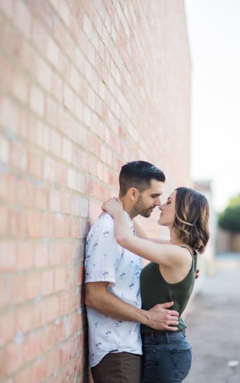 Cute pose to copy if we have time to do the brick wall. Engagement Photos Los Angeles, Christmas Engagement Photos, Military Engagement Photos, Los Angeles Engagement Photos, Posing Couples, Couples Photo Ideas, Engagement Session Posing, Engaged Couples Photography, Urban Engagement