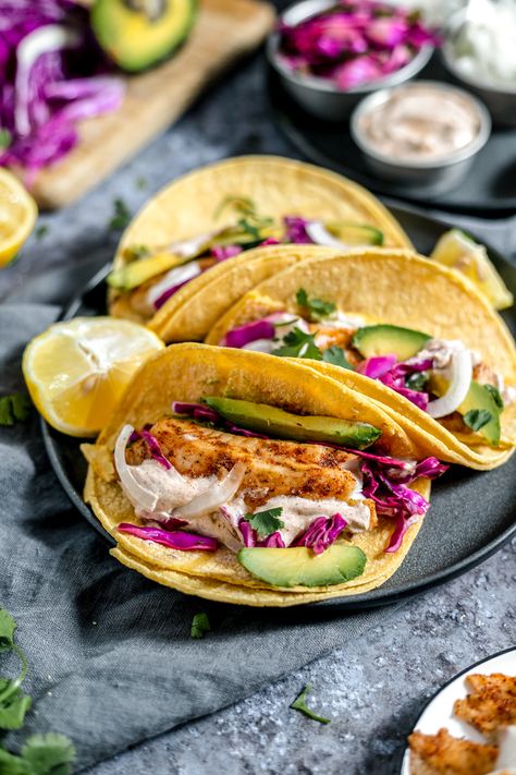 Easy Tilapia Fish Tacos With Crema And Cabbage Slaw Tacos With Crema, Tilapia Fish Tacos, Easy Tilapia, Spicy Crema, Cilantro Lime Crema, Fish Tacos Tilapia, Blackening Spice, Tuna Ceviche, Fish Taco Sauce