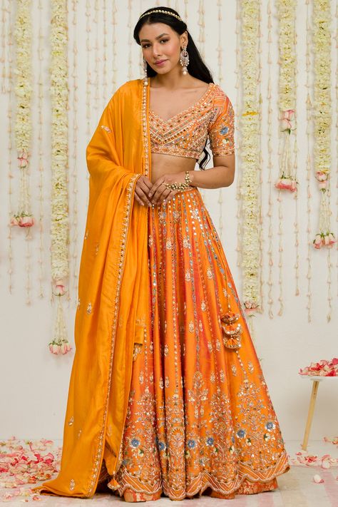 Featuring a rust orange lehenga in raw silk base with mirror and zardosi embroidery. It is paired with a matching embroidered blouse and a pure silk dupatta.  FIT: Fitted at bust and waist. COMPOSITION: Raw silk, Pure silk. CARE: Dry clean only. Orange Lehenga, Indian Bridesmaids, Orange Mirror, Raw Silk Lehenga, Embroidered Lehenga, Ghagra Choli, Sanya, Silk Lehenga, Indian Fashion Designers