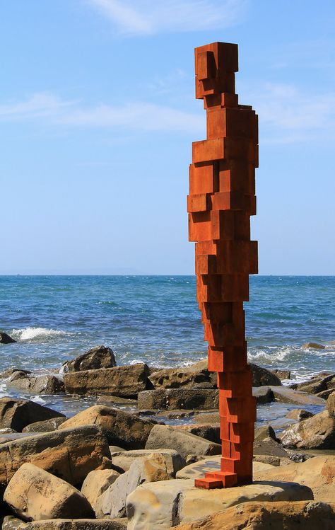 Life-sized sculptures by Antony Gormley at Kimmeridge Bay Dorset oin 2015. Five sites around the UK were specially selected by the artist and each cast-iron sculpture was designed to complement its surroundings.   The commission - entitled Land - was created to mark 50 years of UK building conservation charity Landmark Trust. The nearby Clavell Tower that was moved & renovated by the Trust stands on the cliff above.  Photo rights reserved: Ann Collier Brick Sculpture Art, Kimmeridge Bay, Antony Gormley Sculptures, Anthony Gormley, Plaza Design, Iron Sculpture, Antony Gormley, Public Sculpture, Artistic Installation