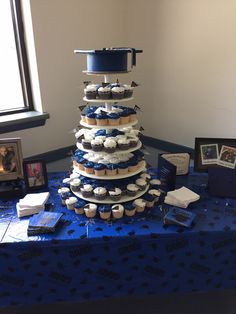 My sons graduation cake/cupcake display 2015 Cake Cupcake Display, High School Graduation Cakes, Graduation Party Pictures, Graduation Party Desserts, High School Graduation Party Decorations, Backyard Graduation Party, Graduation Party Cake, Senior Graduation Party, Boy Graduation