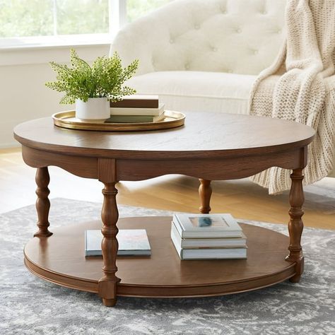 Discover the Pioneer Woman Helen Round Coffee Table in Heirloom Brown, a stunning centerpiece for your living space. With its charming design and durable construction, this table blends rustic elegance with modern functionality. Perfect for family gatherings or cozy evenings, it adds warmth and style to any decor. Elevate your home with this versatile piece that embodies the Pioneer Woman's signature style! Heirloom Home Decor, Round Oak Coffee Table, Vintage Style Coffee Table, Cottage Core Coffee Table, Oval Coffee Table Decor, Small Round Coffee Table, Round Coffee Tables, Living Room Table Sets, Charming Farmhouse