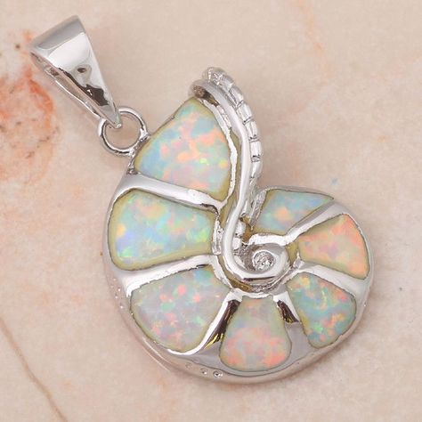 This sea shell pendant is crafted in blue or white fire opal and set in sterling silver. Art Coquillage, Solitaire Necklaces, African Jewelry, Best Jewelry Stores, Solitaire Pendant, Shell Pendant, Hippie Chic, Cute Gift, Opal Jewelry