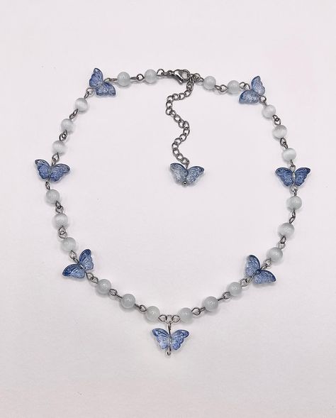 I had no idea what to name this baby but here she is! Butterfly Choker/Necklace 🦋 made with white cat eye beads, glass butterfly beads, stainless steel findings, and a stainless steel extension chain + lobster clasp 16.5in + 3in extension chain available now, link in bio 🦋 #handmade #butterfly #jewelry #explorepage Butterfly Choker Necklace, Cat Eye Beads, Steel Extension, Butterfly Choker, Butterfly Beads, Handmade Butterfly, Glass Butterfly, Eye Beads, Butterfly Jewelry