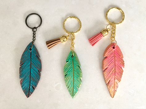 DIY air dry clay keychains - keychains with tassels - air dry clay feathers - antiqued clay - antiquing - vintage inspired Diy Air Dry Clay Keychains, Terracotta Clay Keychains, Easy Clay Keychains, Air Dry Clay Key Chains, Mouldit Keychain Ideas, Air Dry Clay Ideas Keychain, Fevicryl Mouldit Ideas Keychain, Mouldit Clay Keychain, Mouldit Clay Art Keychain