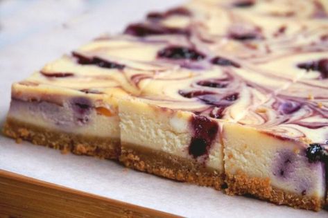 Blueberry Swirl Cheesecake Slice | The Annoyed Thyroid Lemon Blueberry Cheesecake Bars, Blueberry Swirl Cheesecake, Cheesecake Fudge, Cheesecake Slice, Blueberry Cheesecake Bars, Blueberry Cheesecake Recipe, Lemon Blueberry Cheesecake, Swirl Cheesecake, Afternoon Tea Recipes