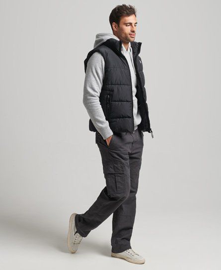 Achieve your goals in style this season. Whether you just want something to keep you warm or something to keep your arms free for an active lifestyle, the Sports Puffer Gilet can deliver on both. Relaxed fit – the classic Superdry fit. Not too slim, not too loose, just right. Go for your normal size Zip fastening Two front zip pockets Bungee cord adjustable hem Fleece lining Recycled padding Internal mesh pocket Embroidered Code logo on ches Embroidered Superdry logo on back of neck Durable wate Sleeveless Puffer Jacket Outfit Men, Sleeveless Puffer Jacket Outfit, Puffer Vest Outfit Men, Vest Men Outfit, Puffy Vest Outfit, Sleevless Jacket, Puffer Jacket Outfit Men, Black Vest Outfit, Man Fits