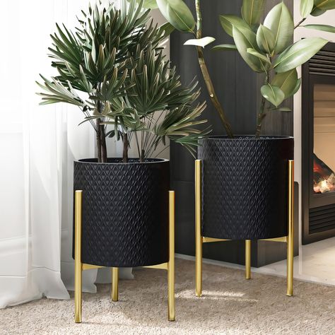 PRICES MAY VARY. A geometric diamond-shaped pattern offers a stylish look to the planter pots, while the gold stands give it a luxury contemporary vibe. Each gold stand is sturdy and will securely hold metal cachepots while the stand foot pad designs protect floor to prevent any scratches or scuffs. Crafted from durable iron, all metal cachepot planter set includes 1 large cachepot, 1 small cachepot, and 2 gold stands. Decorative planter set: these metal planter pots have no drainage holes; leav Gold Planter, Black Planters, Metal Plant Stand, Floor Plants, Luxury Contemporary, Modern Planters, Metal Planters, Decorative Planters, Indoor Plant Pots