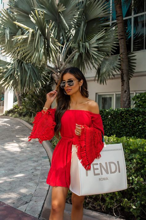 fashion blogger wearing a red off the shoulder dress and white fendi sunshine tote in miami. click here to see more resort vacation dresses, beach outfits for women, cute beach dresses, off the shoulder dresses, flirty summer dresses, and miami vacation style. #vacationoutfit #traveloutfit #beachoutfit Miami Vacation Outfits, Resort Vacation Outfits, Mia Mia Mine, Miami Vacation, Fendi Dress, Flirty Outfits, Mia Mia, Miami Outfits, Embellished Skirt