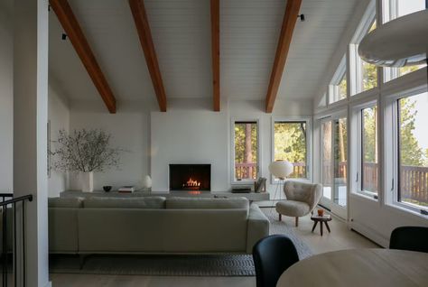 Photo 8 of 18 in Before & After: A Wood-Laden Lake Tahoe Cabin Gets a Dose of Scandi Cool - Dwell Noguchi Lamp, Lake Tahoe Cabin, Tahoe Cabin, Cabin Renovation, Fireplace Facade, Nordic Furniture, Exclusive Home, Entrance Mat, Oak Cabinets