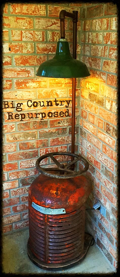 The light is an antique porcelain barn light, and the base is an antique Case tractor grill. Also have an antique tractor steering wheel that is solid cast iron to make a shelf for a piece of glass. Would make a nice corner table or side table. $350 Tractor Grill Repurposed, Tractor Table, Tractor Bar, Tractor Decor, Backyard Patio Furniture, Upcycle Design, Furniture Upcycling, Modern Rustic Farmhouse, Industrial Table Lamp