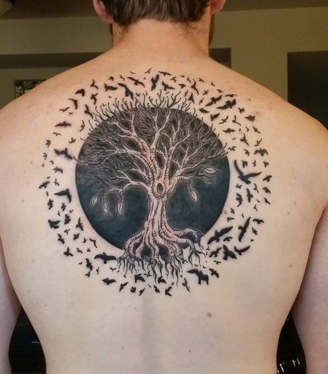 In tattoo art, a tree symbolizes life-and every part has a deep meaning. The roots signify the strong foundation, keeping the entire tree firmly grounded beneath the soil. The trunk depicts resilience, standing up to… Dedication Tattoos, Yggdrasil Tattoo, Tato Dengan Makna, Upper Back Tattoos, Forest Tattoos, Tree Tattoo Designs, Back Tattoos For Guys, Tree Of Life Tattoo, Celtic Tree Of Life