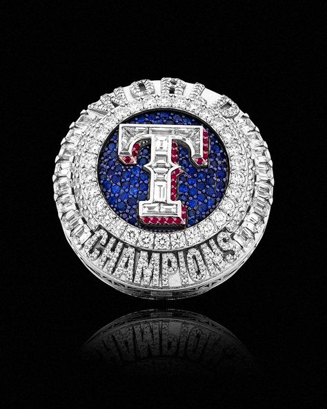 IN A DAZZLING DISPLAY OF ARTISTRY AND SYMBOLISM, THE TEXAS RANGERS HAVE UNVEILED THEIR REMARKABLE WORLD SERIES CHAMPIONSHIP RINGS, A TESTAMENT TO THEIR HISTORIC TRIUMPH IN FRANCHISE HISTORY. CRAFTED WITH METICULOUS DETAIL BY RENOWNED JEWELER ARASHEBEN, EACH RING IS A MASTERPIECE THAT ENCAPSULATES THE RANGERS' JOURNEY TO BASEBALL GLORY. Mexico National Team, World Series Rings, Story Of The Year, Trophy Design, Us Soccer, Baseball Uniforms, Championship Rings, Mlb Players, Soccer Kits