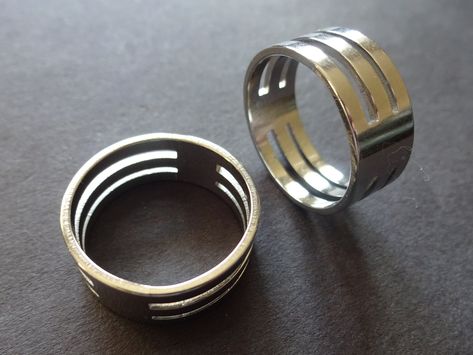 This listing is for a Cut Out Geometric Style Stainless Steel Ring.  The ring features a unique geometric cut out style design. These unisex rings are great for a subtle modern design. Type- Ring Sub-Type- Metal Ring Style- Modern, Geometric, Unisex Size- US/Canada Sizing, 17mm (Size 7) - 20mm (Size 10) Width- 81mm Thickness- 1mm Accents- Cut out stripe design Metal Type- Stainless Steel  Color- Silver  Why should you shop with Beadology By Heather? -We have a large amount of premium beads and s Unisex Rings, Cutout Design, Stainless Steel Ring, Special Jewelry, Unisex Ring, Ring Style, Unisex Jewelry, Metal Ring, Men's Ring