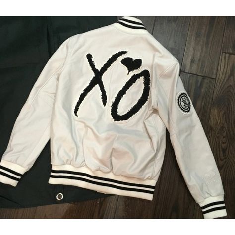 Weeknd XO Varsity Jacket Black and White is inspired by the varsity jacket worn by the singer, song writer and artist Weeknd perfect for COSPLAY. Premium Wool All Climate comfort Ultimate portability, packs like a shirt European Profile - great for layover excursions Liner provides comfort in below 0 climates Features 2 inside pockets decent size to accommodate larger cell phones Action back with pleats for comfort and arm flexibility Windbreaker flap over the main jacket zipper 2 outside cross Varsity Jacket Black, Singer Song Writer, Jacket Black And White, Singer Song, Jacket Zipper, Men's Leather Jacket, Current Fashion Trends, Brown Leather Jacket, Leather Biker Jacket