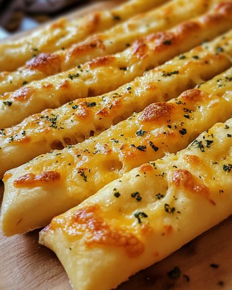 These Cheesy Garlic Breadsticks are a family favorite! They're cheesy, garlicky, and disappear in seconds!  Ingredients: - Pizza dough - Garlic butter  - Mozzarella cheese   For the rest of the delicious details, Link in first comment [👇] [👇]  Everyone I know loves these. They're quick, easy, and perfect for sharing!   #CheesyGarlicBreadsticks #ComfortFood #Homemade #Yummy #EasyRecipes Papa Johns Cheese Sticks, Garlic Fingers, Cheesy Garlic Breadsticks, Cheese Stick, Garlic Breadsticks, Cheesy Garlic Bread, Cheese Sticks, Yummy Comfort Food, Edible Food