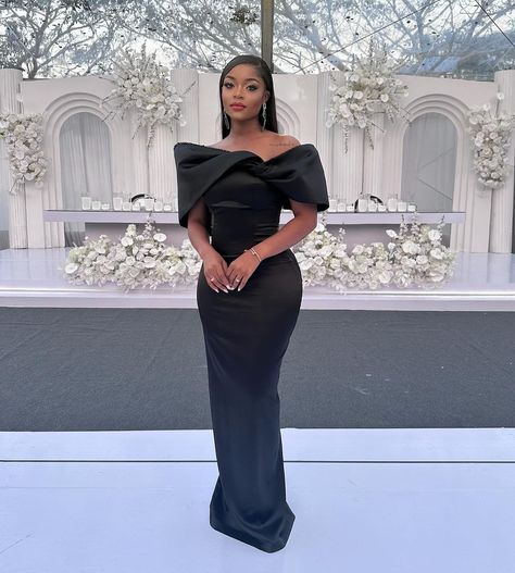 Achieve a Stylish Wedding Guest Status With These 10 Looks Elegant Black Wedding Guest Dress, All Black Formal Wedding Guest Attire, Black Elegant Bridesmaid Dresses, Wedding Guest Dress Ideas Black Women, Formal Wedding Guest Dress Classy, Outfit For Fashion Show Guest, Elegant Wedding Guest Dress Classy, Gala Dresses Black Women, Nice Dresses For Wedding Guest