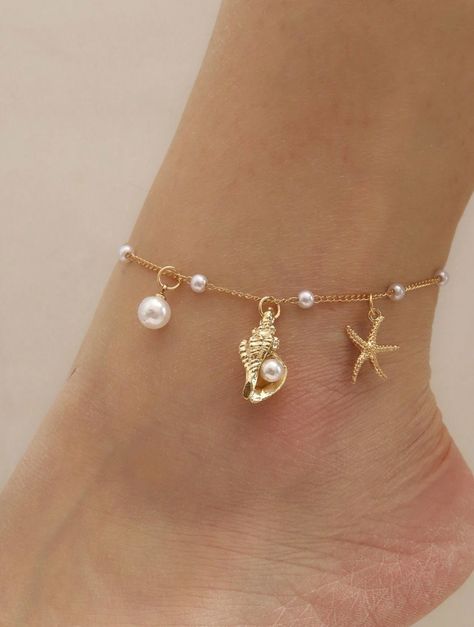 Dive into summer with our Ocean Breeze Anklet, a delicate piece that captures the enchanting beauty of the sea. This dainty gold anklet features a charming starfish, a tiny conch shell, and luminous pearls, evoking the serene vibes of a beach getaway. Lightweight and effortlessly chic, it's perfect for adding a touch of coquette elegance to your summer wardrobe. Embrace the ocean's magic with every step you take! Ocean Jewelry Aesthetic, Beach Jewelry Aesthetic, Gold Dainty Jewelry, Engagement Brunch, Life Gifts, Summer Wishlist, Anklet Gold, Surf Jewelry, Pretty Jewelry Necklaces