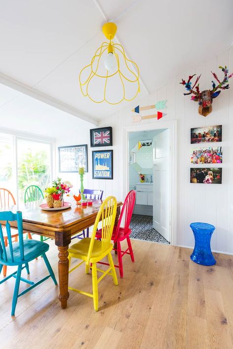 A Brisbane couple transform a character-filled Queenslander-style cottage, which was in desperate need of an renovation. Take a look inside! Dining Table With Different Color Chairs, Colorful Kitchen Tables, Colorful Dining Room Chairs, Reapolstering Chairs, Painting Kitchen Chairs, Cozy College Dorm, Colored Dining Chairs, Bedroom Ideas Cozy, Traditional Dining Chairs