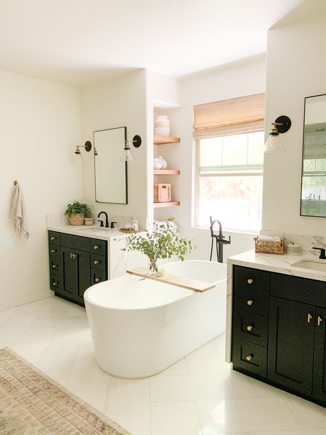 Freestanding Tub Between Vanities, Tub In Between Vanities, Floating Tub Master Bath, Bathtub Between Two Vanities, Tub Between Vanities, Tub Between Two Vanities, Built In Floating Shelves, Beige And Black Bathroom, Black Vanities