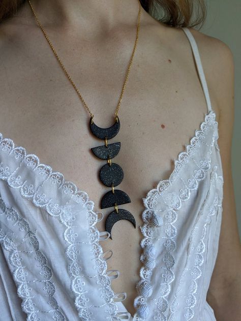 A stunning statement piece embracing your inner moon goddess! This moon phase necklace is a show stopper. Also available as a set with earrings! The 18K gold plated chain is 22 inches long with an adjustable clasp to lengthen it further. ► Please note that all my pieces are HANDMADE, so every piece Luna Necklace, Moon Phase Jewelry, Mystical Necklace, Witch Vibes, Studio Jewelry, Moon Phases Necklace, Polymer Clay Jewelry Diy, Polymer Clay Necklace, Clay Jewelry Diy