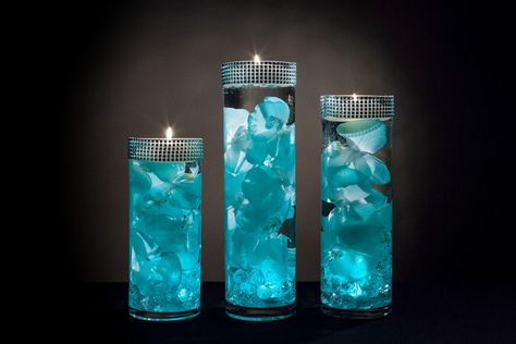 Teal Floral Centerpieces with LED Lights and Floating Candles Aquamarine Centerpieces, Teal Table Decor, Teal Centerpieces, Led Centerpieces, Tiffany Blue Wedding Theme, Teal Vase, Floating Candle Centerpieces, Vase Diy, Tiffany Blue Wedding