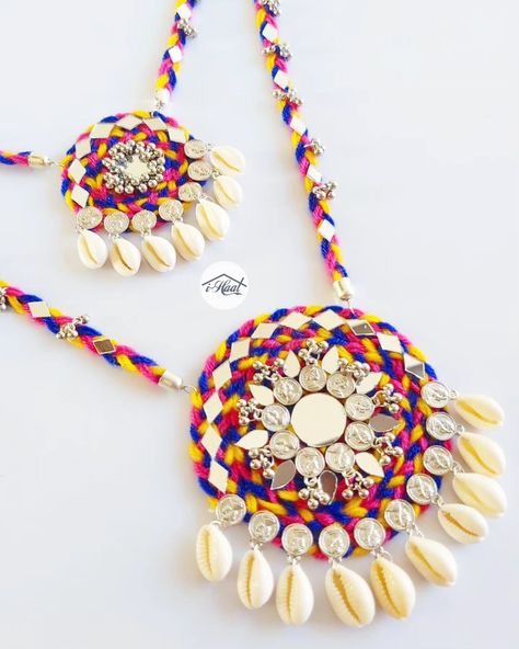 Are you someone who's already been shopping for her Navratri look? Checkout this beautiful Multicolored jewellery set adorned with lots of mirrors, Cowrie shells, coins and ghungroo to match your Garba Vibes for this Navratri Season 🔥 This 2 layered long necklace and earrings makes you stand out in the crowd and match perfectly with every outfit ❤️ Visit indiashaat.com for more handmade jewellery options #indiashaat #navratrijewellery #bohojewellery #multicolorjewellery #letajaijo [Ha... Jewellery For Navratri, Navratri Look, Traditional Jewellery, Cowrie Shells, Easy Diy Jewelry, Handmade Jewelry Designs, Cowrie Shell, Jewellery Set, Traditional Jewelry