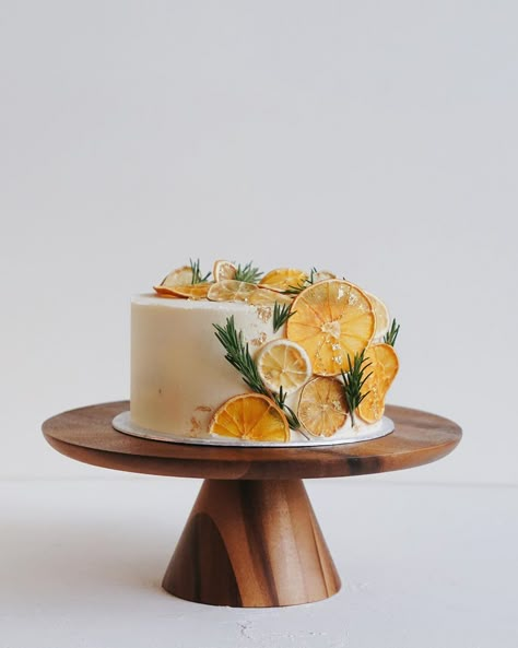 Small winter wedding cake | chocolate cake, orange and basil curd, vanilla buttercream Candied Citrus Cake Decoration, Candied Lemon Slices Cake Decoration, Candied Lemons Cake Decoration, Cake Decorated With Oranges, Citrus Birthday Cake, Citrus Decorated Cake, Dried Citrus Cake, Citrus Cake Decoration, Orange Decorated Cake