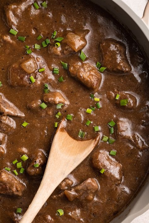 So incredibly delicious and easy to make, this beef tips and gravy recipe is rich and comforting. All cooked in one pot, the beef is tender and simmered in flavorful gravy. Serve over potatoes, rice or pasta for a delicious meal everyone will love. Beef Tips And Gravy Recipe, Diced Beef Recipes, Grilled Beef Ribs, 40 Aprons, Canning Refried Beans, Beef Tips And Gravy, Iron Recipes, Beef Gravy, Vegetarian Tacos