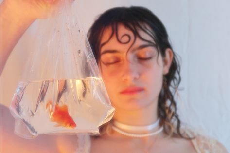 girl holding a plastic bag which contains a goldfish. the photo is somehow blured just like a dream Goldfish Photoshoot, Fish Bowl Aesthetic, Fish Photoshoot, Fish Aesthetic, Fish Goldfish, Goldfish Bowl, Fishing Wedding, Fish Tales, Gold Fish