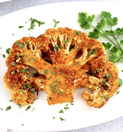 Roasted Cauliflower Steaks These Roasted Cauliflower Steaks are seasoned and roasted to absolute perfection. Easy, yet elegant, this cauliflower recipe is bursting with flavor and makes a creative centerpiece for any meal. #cauliflowersteaks #ketocauliflower Baked Cauliflower Steaks, Steaks Recipes, Cabbage Steaks Recipe, Cauliflower Steaks Recipes, Low Carb Paleo Recipes, Roasted Cauliflower Steaks, Homemade Pesto Sauce, Keto Sides, Roasted Cauliflower Recipes