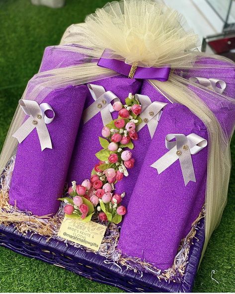 Bride’s kente and cloths in a purple cane basket wrapped in a purple and light brown color theme. Dowry Wrapping Ghana, Engagement Wrapping Ideas Ghana, Traditional African Wedding, Ghana Traditional Wedding, Engagement Gift Baskets, Nigerian Traditional Wedding, Wedding Gift Pack, Bridal Gift Wrapping Ideas, Wedding Gifts Packaging