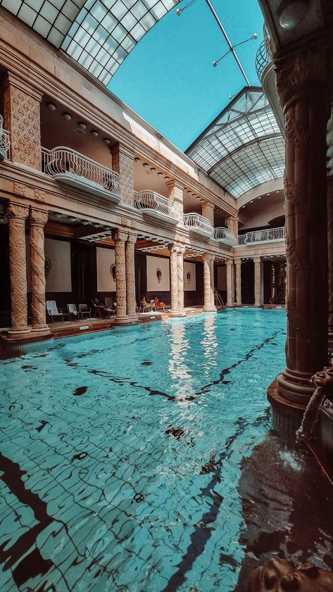 Semi outdoor pool with beautiful clear blue water and antic columns. Gellert Thermal Bath Budapest, Budapest Baths, Budapest Winter, Budapest Vacation, Budapest Thermal Baths, Bath Aesthetic, Thermal Baths, Thermal Pool, Hungary Travel