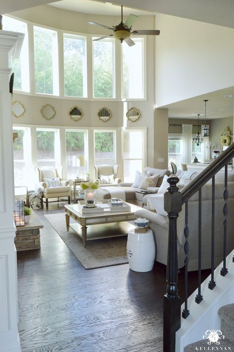 Kelley Nan: Form vs. Function in the Family Room: Balancing the Pretty with the Practical - Two Story Great Room with High Ceilings and Neutral Decor- Living Room Ideas with Mirrors Between two rows of windows Furniture Arrangement Ideas, Pottery Barn Living Room, Room Neutral, Barn Living, Living Room Furniture Arrangement, Arrangement Ideas, Neutral Living Room, Style At Home, Great Room