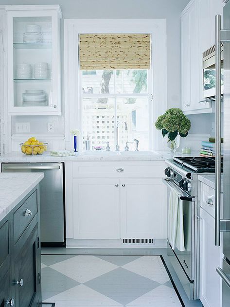 Oversize diamonds painted on this floor create diagonal lines that give the eye a longer path to follow from one side of the room to the other, so the room feels wider than it really is. Combine this technique with low-contrast colors for big results in a small kitchen. Tiles Backsplash, Floor Pattern, Gardening Projects, Cabinet Display, Painted Floor, Floor Ideas, Dream Kitchens, Grey Granite, Painted Rug