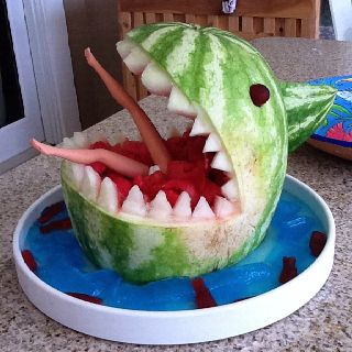 Shark watermelon! Love the added barbie touch! Megalodon Party, Shark Watermelon, Watermelon Shark, Shark Week Party, Spooky Dinner, Ocean Birthday Party, Birthday Party Games For Kids, Watermelon Carving, Amazing Food Decoration