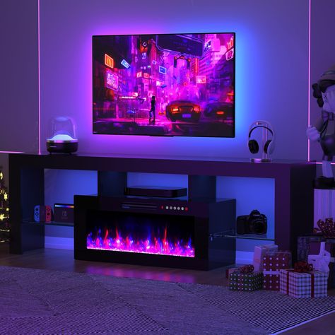 PRICES MAY VARY. Fits TVs 80"+: This modern 70 inch tv stand accommodates up to 80-inch TVs within its broad 70-inch design, complemented by an integrated 36-inch electric fireplace for a cozy atmosphere. Maximum weight capacity: 250 lbs. Multiple Color Combinations: Elevate your ambiance with our lifelike 36-inch fireplace adorned with realistic crystal stones. Explore 12 vibrant flame colors with a fire gradient effect, and tailor brightness across 5 levels for the ideal setting. The LED light Tv Fireplace Stand, Fireplace Stand, Fireplace Tv Console, Electric Fireplace Entertainment Center, 70 Inch Tv Stand, Bachelor Pad Decor, Tv Fireplace, Electric Fireplace Tv, Floating Fireplace