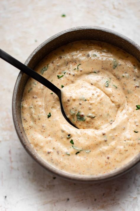 This New Orleans remoulade sauce is good on everything from crab cakes to po'boy sandwiches to fried green tomatoes. It's easy to make, spicy, tangy, and it's sure to become your new favorite spread. Remolaude Sauce, Cajun Remoulade Sauce Recipe, Cajun Remoulade Sauce, Remoulade Sauce Recipe, Crab Cake Sauce, Cajun Remoulade, Vegan Crab Cakes, Vegan Crab, Remoulade Sauce