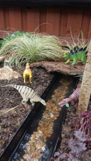 Dinosaur garden - Everyone needs one of these - maybe add little army men! Dino Garden, Fairy Garden Design Ideas, Cute Fairy Garden, Barn Crafts, Dinosaur Garden, Kids Yard, Play Garden, Dinosaur Room, Water Drain